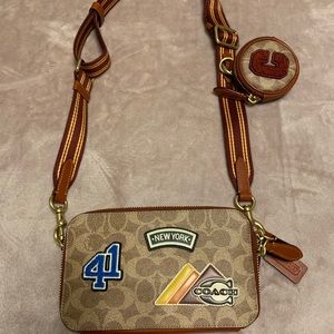Coach - Charter slim crossbody in signature canvas with patches.